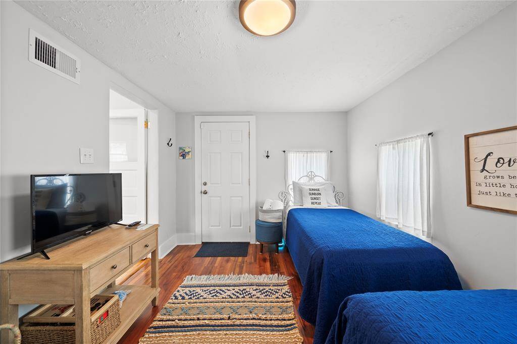 Flex Space that is currently set up with 2 twin beds and a play space.  It does have a door from the kitchen you can close for privacy and would make a great home office or play area for children.