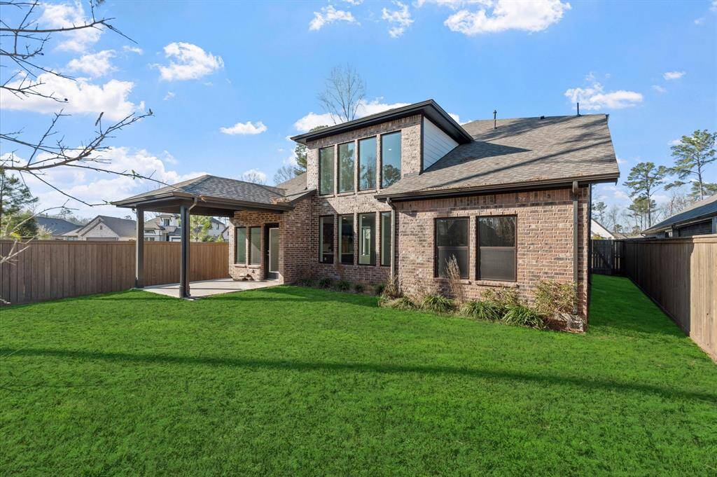 Backyard with covered patio(Grass has been Enhanced)