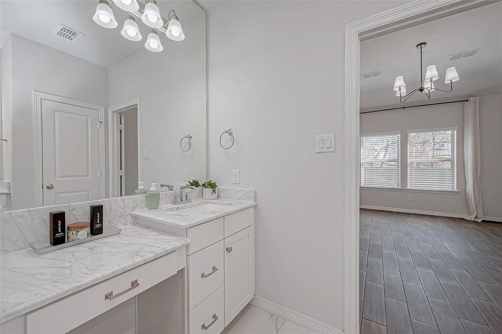 View of Left vanity area looking into Primary Bedroom