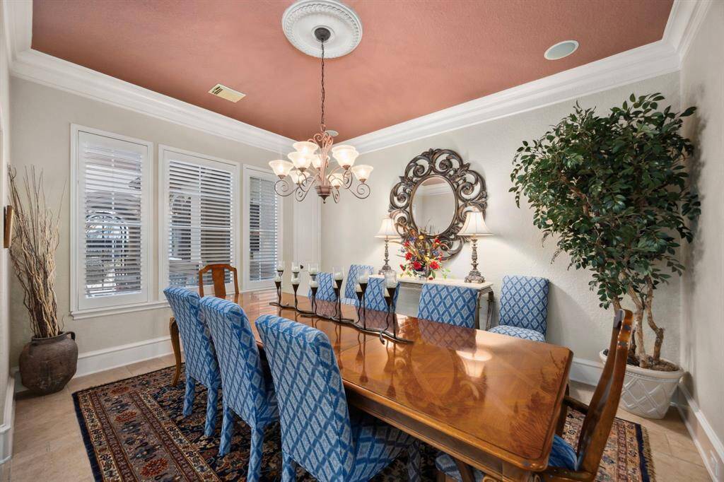 The formal dining overlooks the courtyard and offers storage space in its own closet.