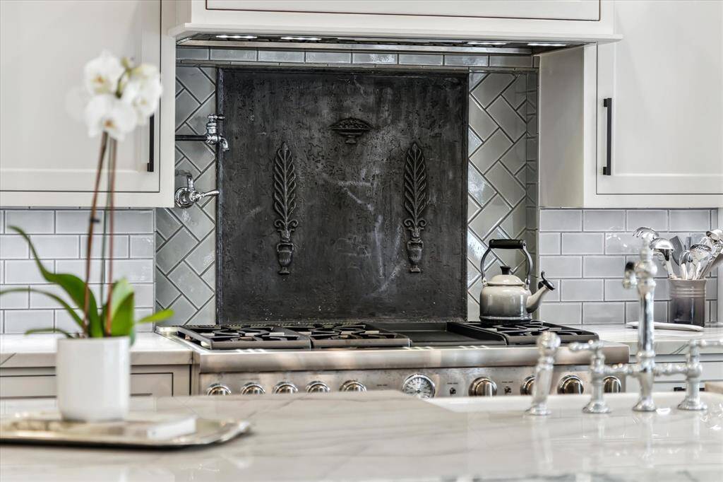 The sellers incorporated so many special details into the design including this antique iron fireback  from Belgium.