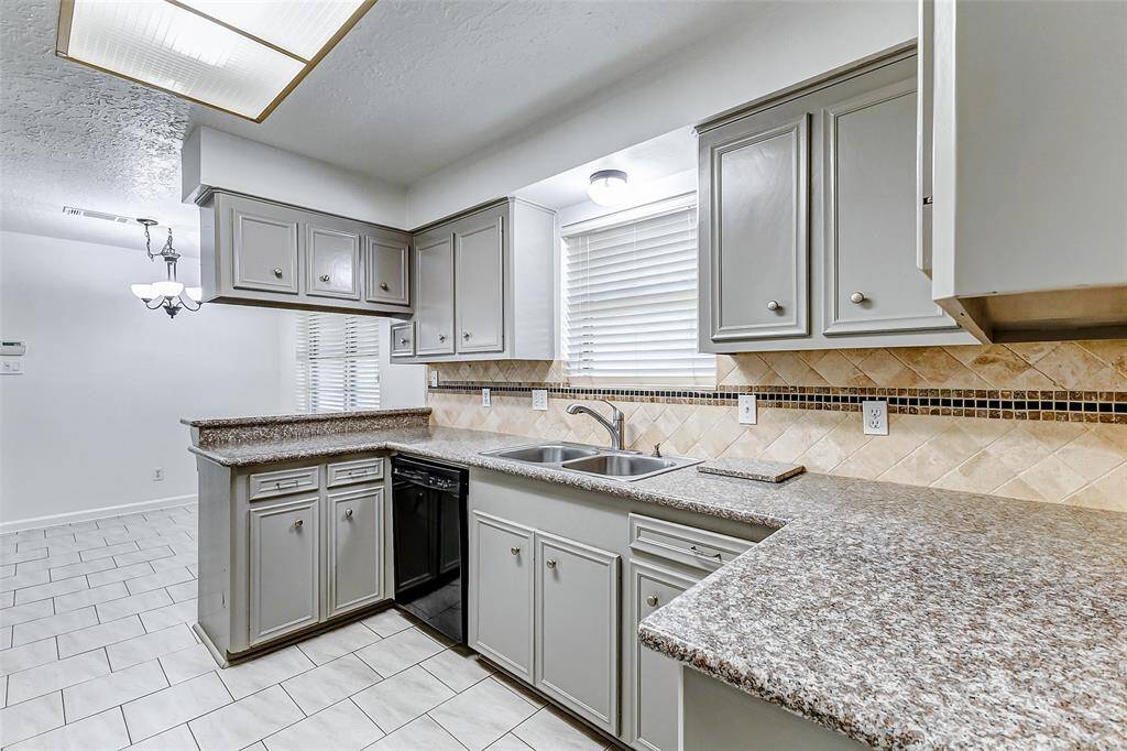 The wrap-around cabinetry ensures ample space for all your kitchenware, keeping everything organized and easily accessible.