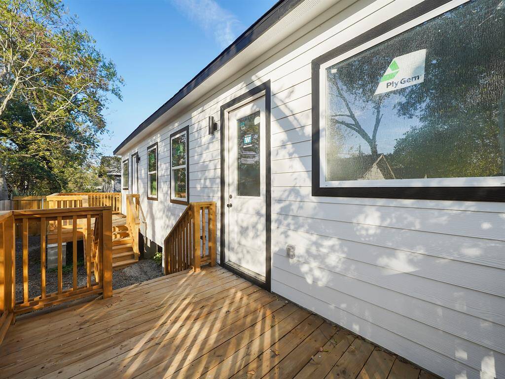 Alternate view of the private deck in Unit A, with access from the main bedroom or via the exterior staircase leading down to the ground. Unit B offers the same convenient access for easy outdoor enjoyment.