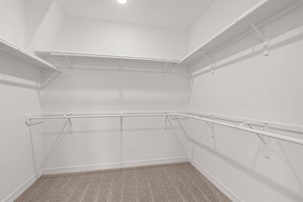 A view of your large primary walk-in Closet
