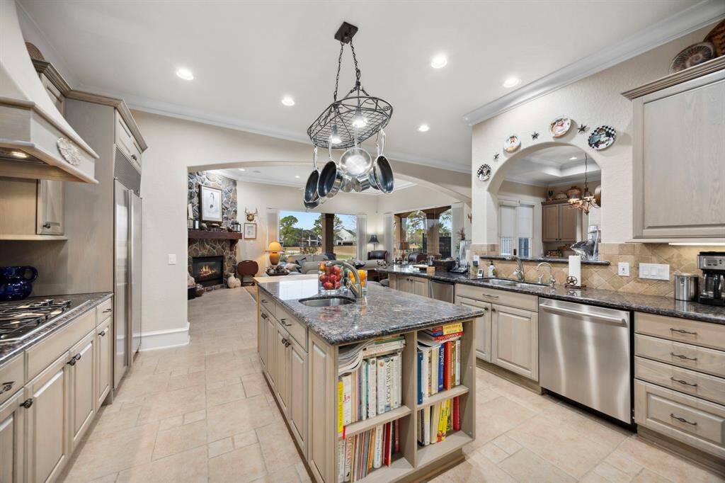 The kitchen is open to the main living room and breakfast area and offers views of the 5th fairway.
