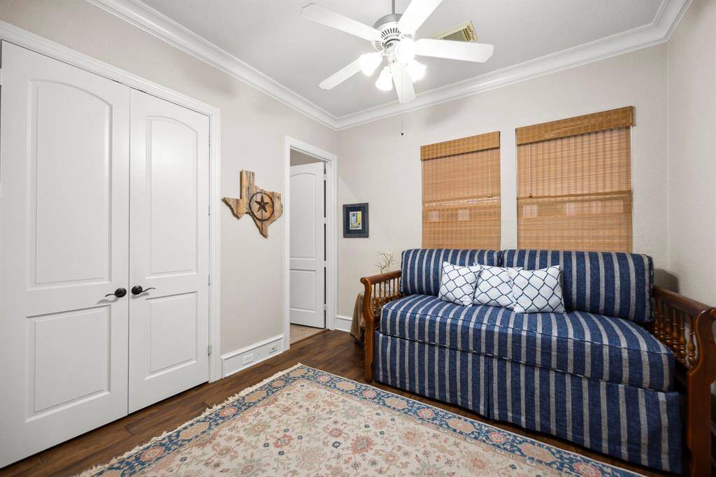 The secondary downstairs bedroom features an ensuite bath.