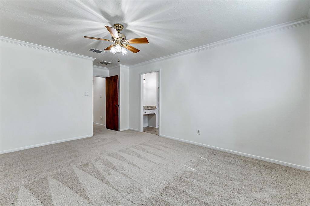 There's ample space for your large bedroom set, along with expansive walls perfect for showcasing your favorite artwork. Just ahead, you'll find the private ensuite bathroom and a spacious walk-in closet, offering both convenience and storage.
