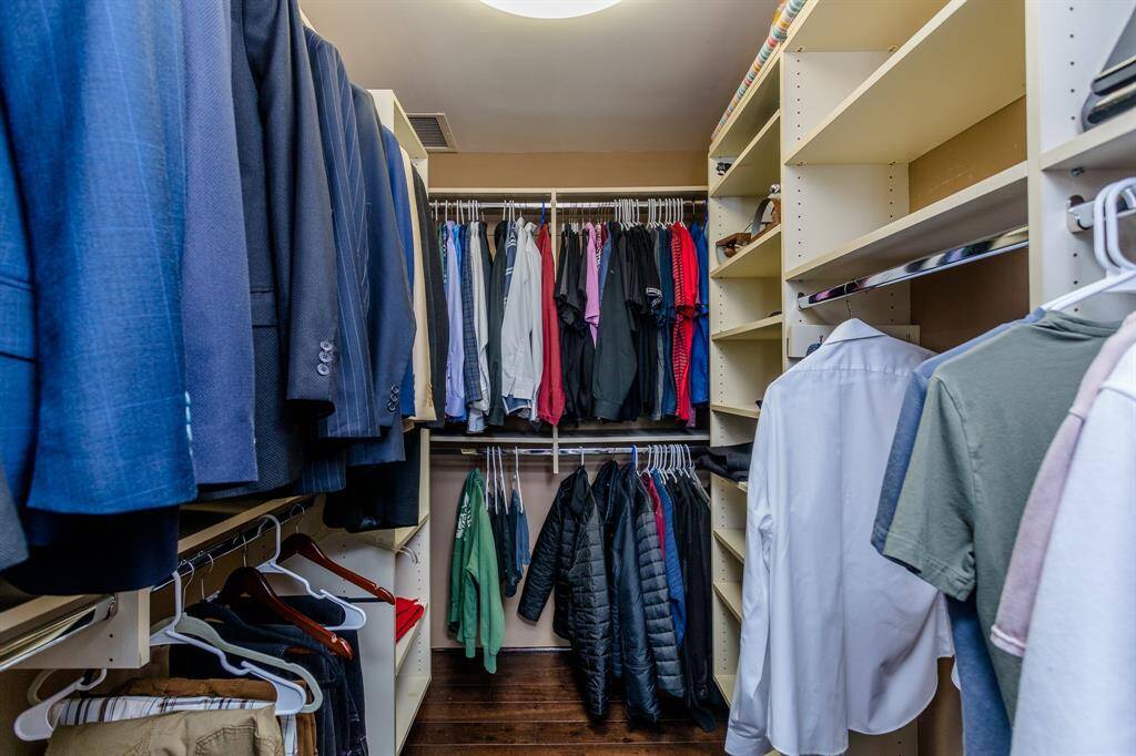Primary bedroom walk in closet
