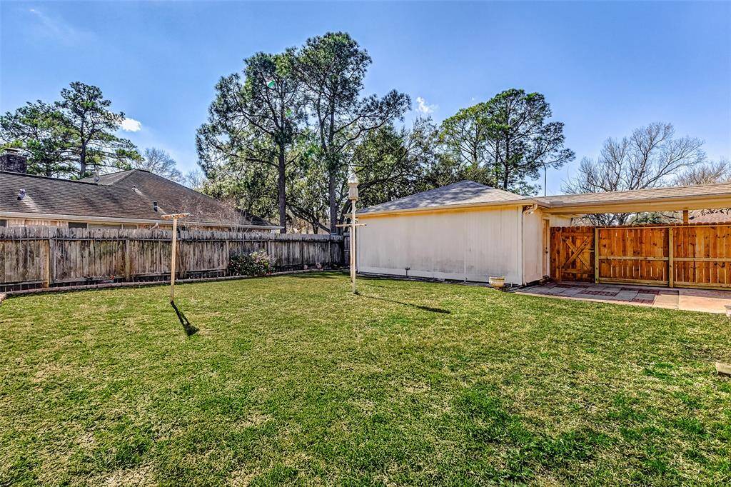 Even with the patio and extension, the backyard offers ample green space, perfect for gardening, entertaining, or giving your pets room to roam. Towering trees provide a scenic backdrop, enhancing the beauty and tranquility of this private outdoor oasis.
