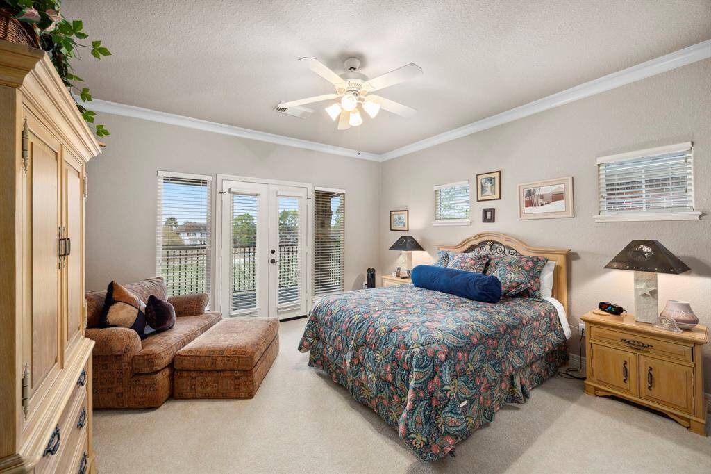This secondary bedroom overlooks the golf course and offers access to the upstairs balcony. It also features an ensuite bath.