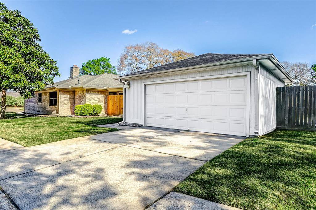 The driveway is conveniently located on the side of the home, leading to a spacious two-car garage with an extension for added storage or a workspace. A side-entry garage enhances curb appeal by keeping the front façade clean and uncluttered while also providing easier access and additional privacy.