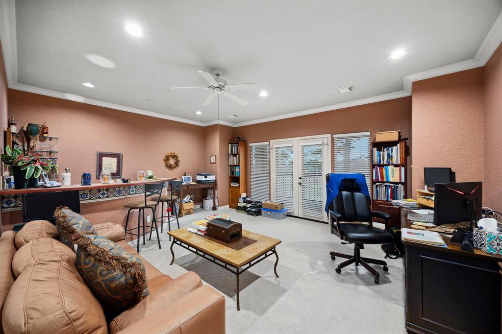 The end of the upstarts hallway leads you into the massive game room complete with built in bar and balcony access.