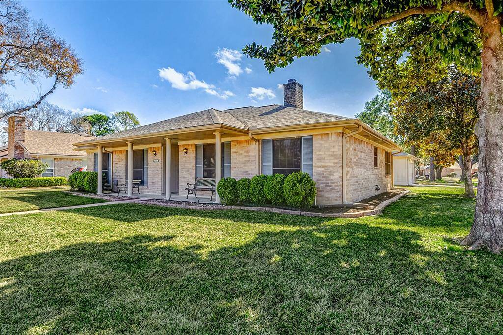 Additional highlights include wraparound gutters for enhanced drainage, a beautifully crafted brick border accentuating the landscaping, and a sprawling front porch that extends across most of the home—perfect for relaxing and enjoying the outdoors.