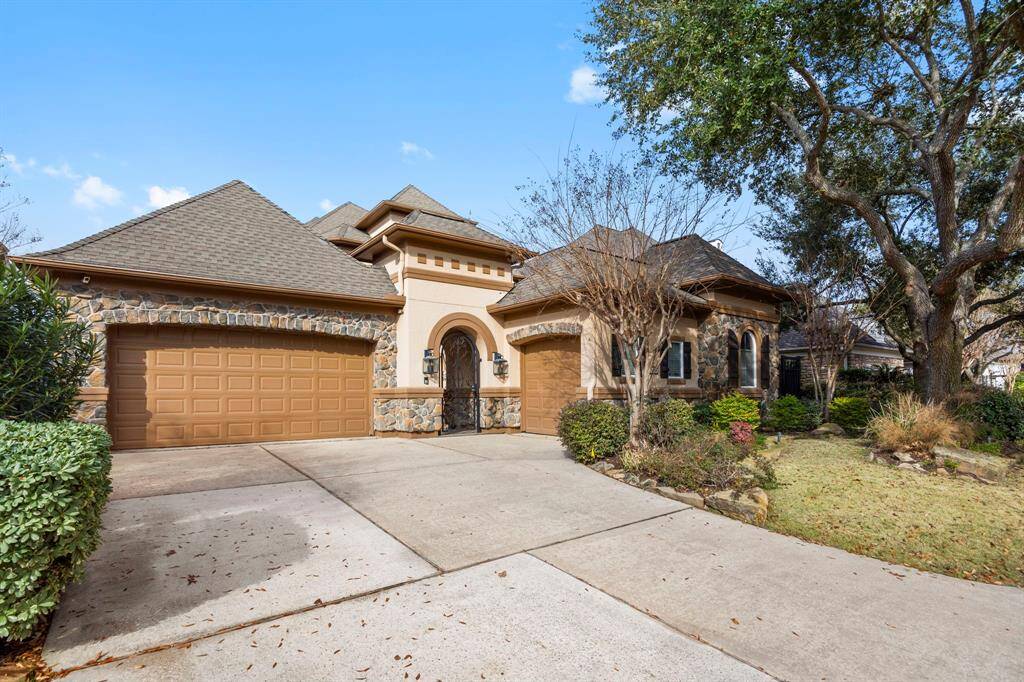 The home features a 3 car garage with additional driveway parking.