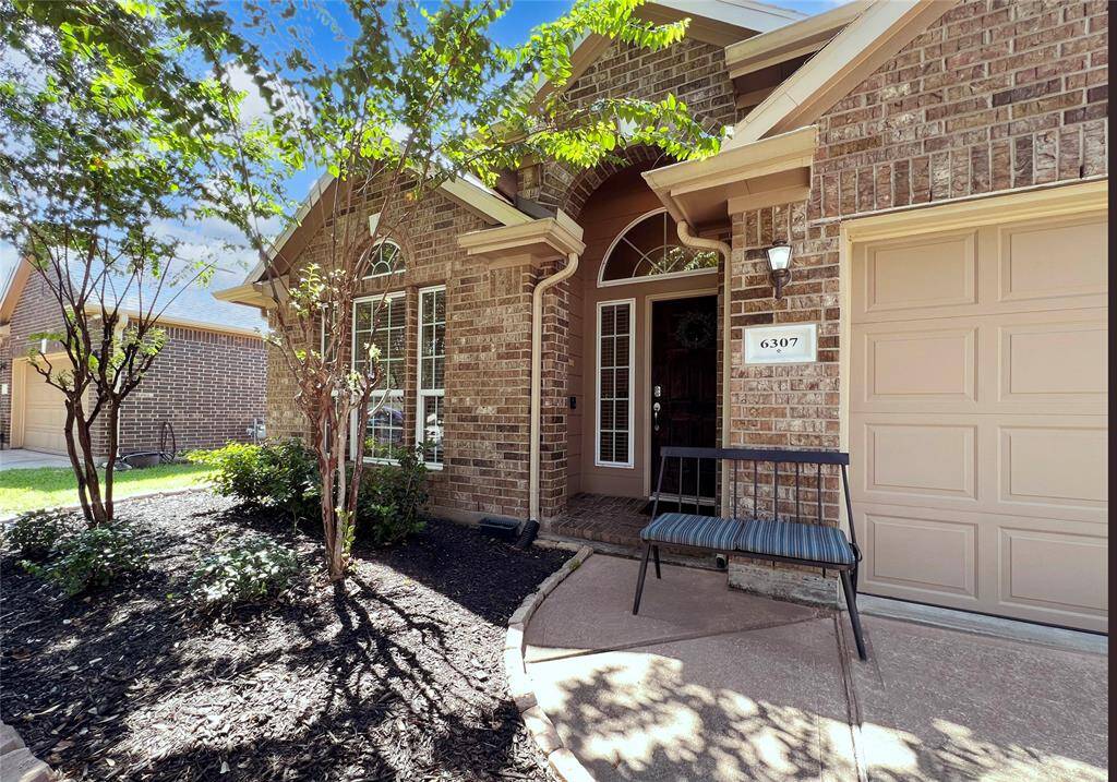 The 2-car attached garage adds convenience.