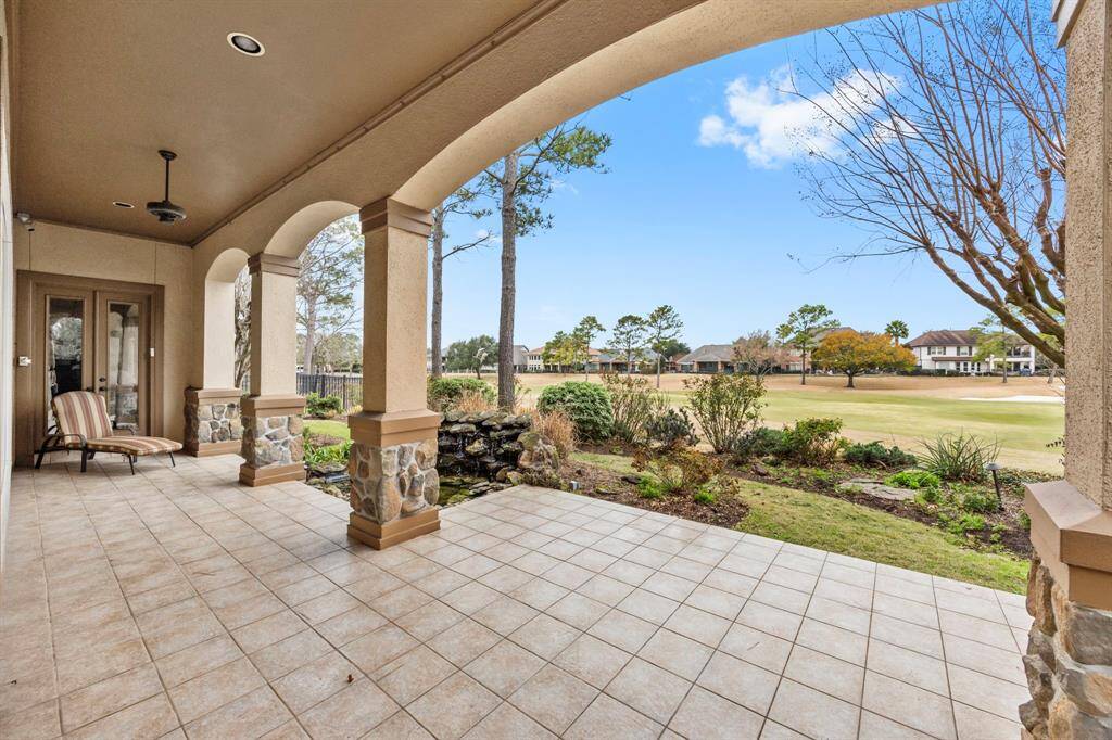 The back patio offers unobstructed views of the golf course and also features a calming fountain.