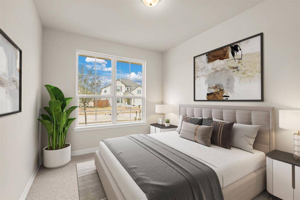 Your secondary bedroom features plush carpet, fresh paint, closet, and a large window that lets in plenty of natural lighting.