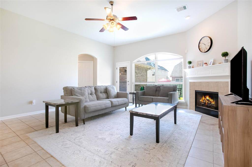 Cozy family roomThe living room features a cozy gas log fireplace and offers beautiful views of the patio and backyard.