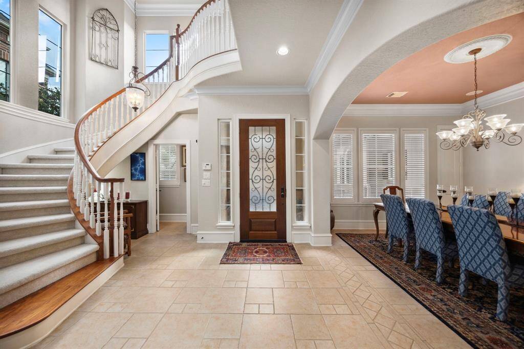 Once inside the home you are greeting by a gorgeous sweeping staircase.