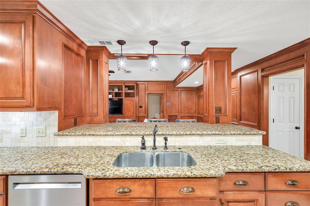 Clear views into the family room from the elegant kitchen