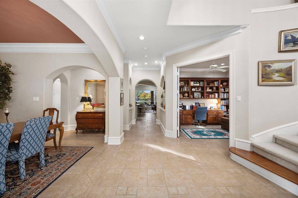 Just inside the front door is the formal dining to the left, and office just past the stairs.