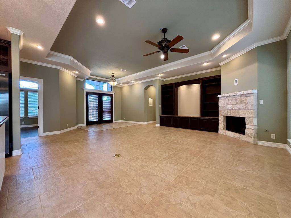 Spread out and enjoy all of your newfound features in your castle! Custom entertainment built-in with recessed downlighting, stone gas fireplace, recessed floor outlet for newer style electric sectional couches or recliner chairs and recessed media outlet ready for your TV over the firepalce!