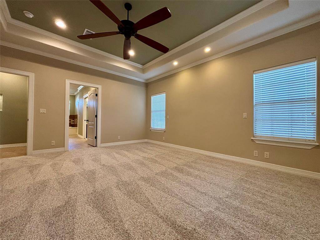 Expansive master retreat with recessed reading lights in the ceiling, tray ceiling and new carpet with upgraded padding for that plush feel!