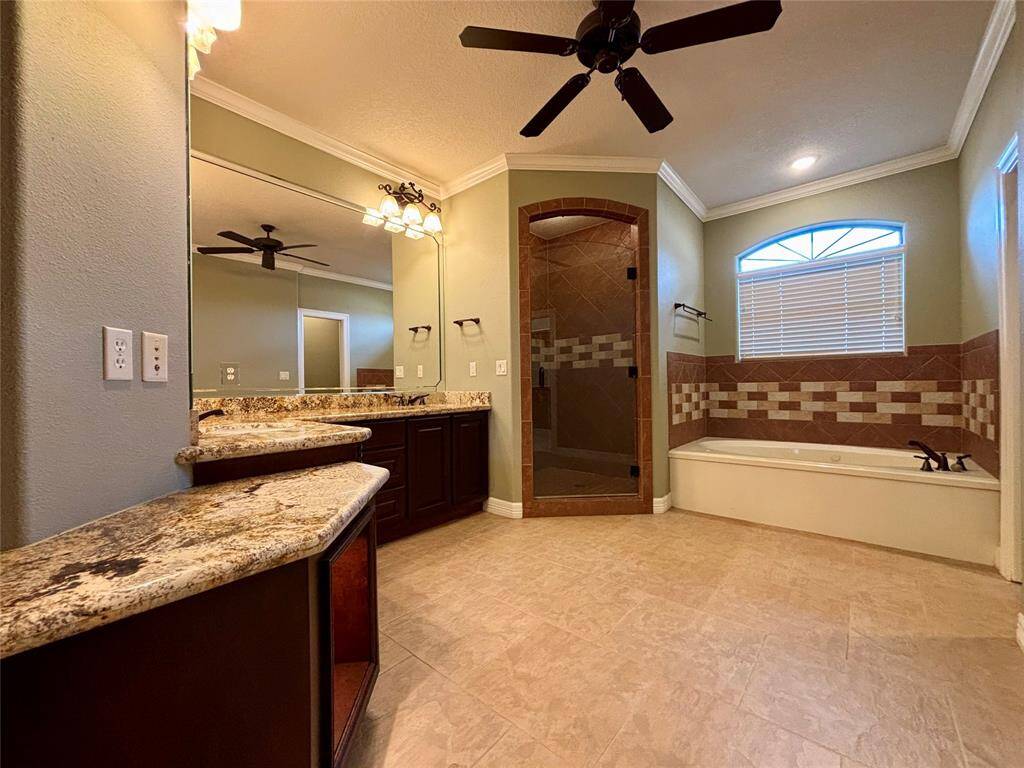 Spa-like master bath will relax and refresh you daily! Large, deep jetted tub, very spacious walk-in shower and the same crown molding and custom electrical touches as in the rest of the home!