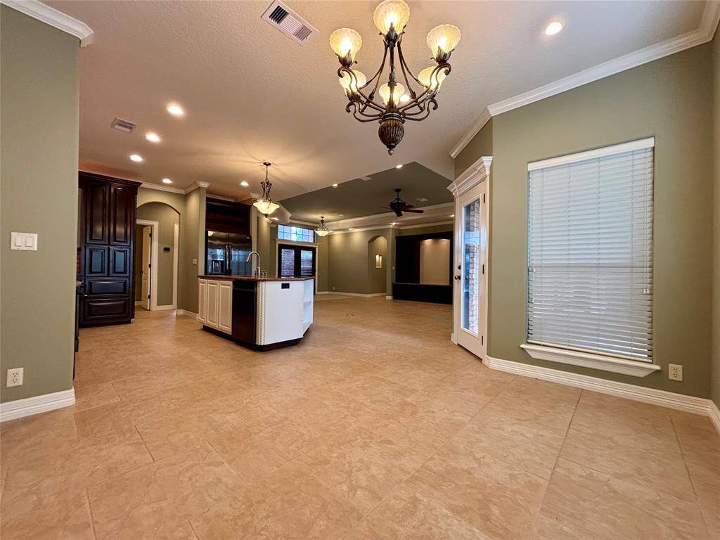 Entryway, living area, breakfast area, kitchen, office and 1/2 bath all join in this open space keeping functionality and convenience together!
