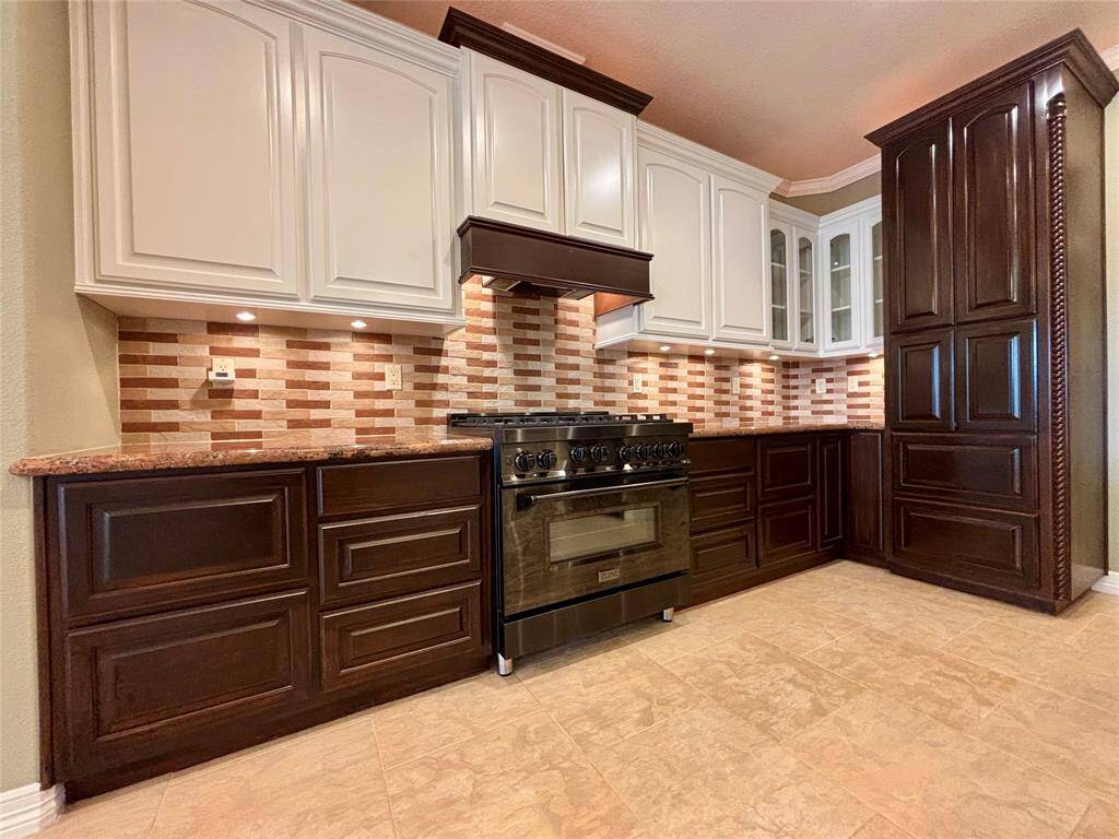 Custom 2-tone cabinetry that is custom built with drawers that have metal sides that attaches to the slide rails and laminated drawer bases along with custom under cabinet lighting and up-lighting on the top cabinets! Lets not pass by the custom Z-Line 6 burner gas ranger and stove and the functional microwave drawer located in the right-side cabinetry.