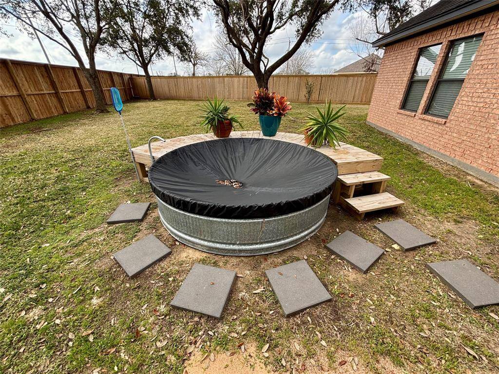 The crown jewel of the backyard, your very own cowboy pool! Custom built wood deck with stairs, pool filter system and pool filler faucet! Pool has been cleaned and covered in preparation to relax and entertain the next onwer...YOU!!!