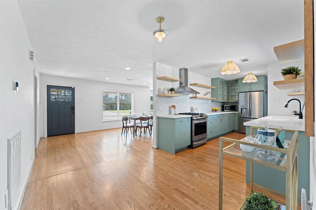 Beautiful, original hardwood floors are found throughout most of the home. Enjoy an open concept floorplan with functional, defined living spaces.