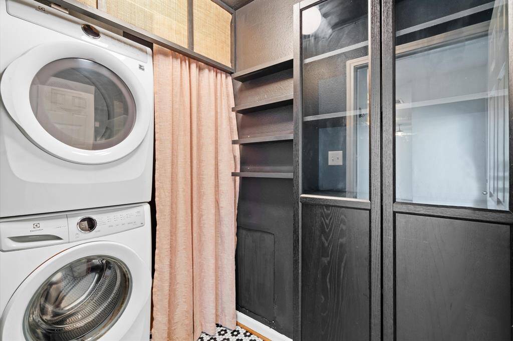 Full size washer and dryer located inside the home adjacent to the walk-in pantry.