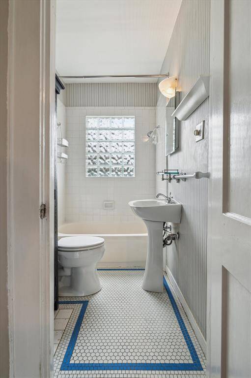 First floor bathroom.  Notice the vintage Houston-themed tile.