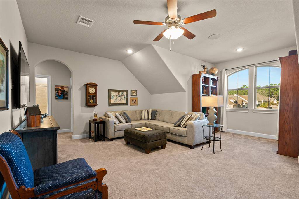 Secondary Living/Gameroom upstairs offers a spacious area to entertain with ample room that can support a pool table.