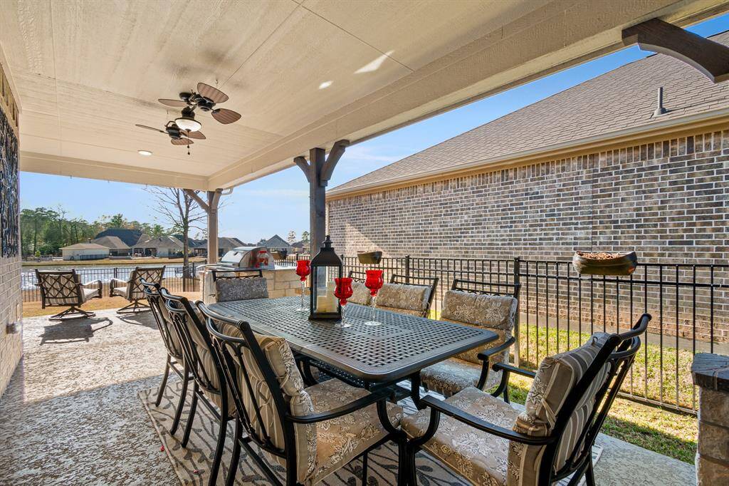 Let this covered patio bring relaxation to you immediately.  With multiple seating areas, it overlooks your fenced yard and your personal waterfront view. This is ideal for outdoor dining and relaxation.