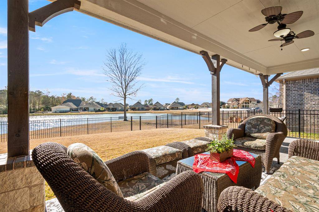 Relaxing covered patio views of the tranquil lake and surrounding neighborhood. It's perfect for outdoor enjoyment and entertaining especially sunsets in the evening!