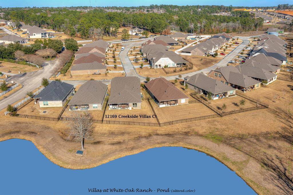 You can see how much you'll love living at 12169 Creekside Villas Ct.  In addition to the Community Lake, you have access to Lake Conroe for recreational fun.