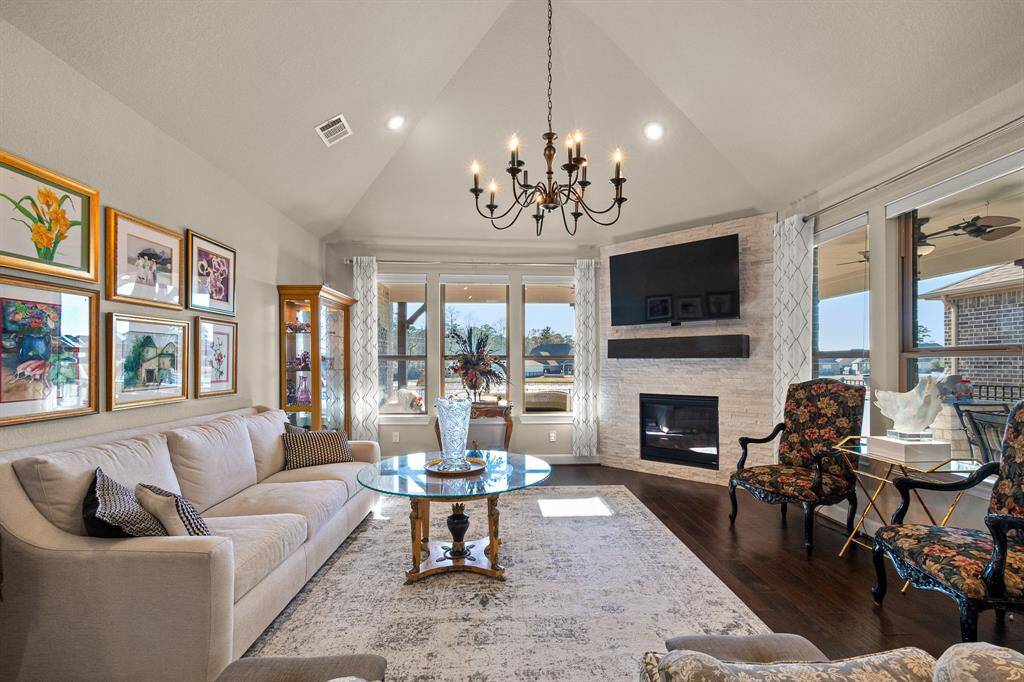 Discover tranquility in this serene home with views of the Community Lake.  You'll love the 14-foot vaulted ceiling and remote-controlled shades in the Living Room.
