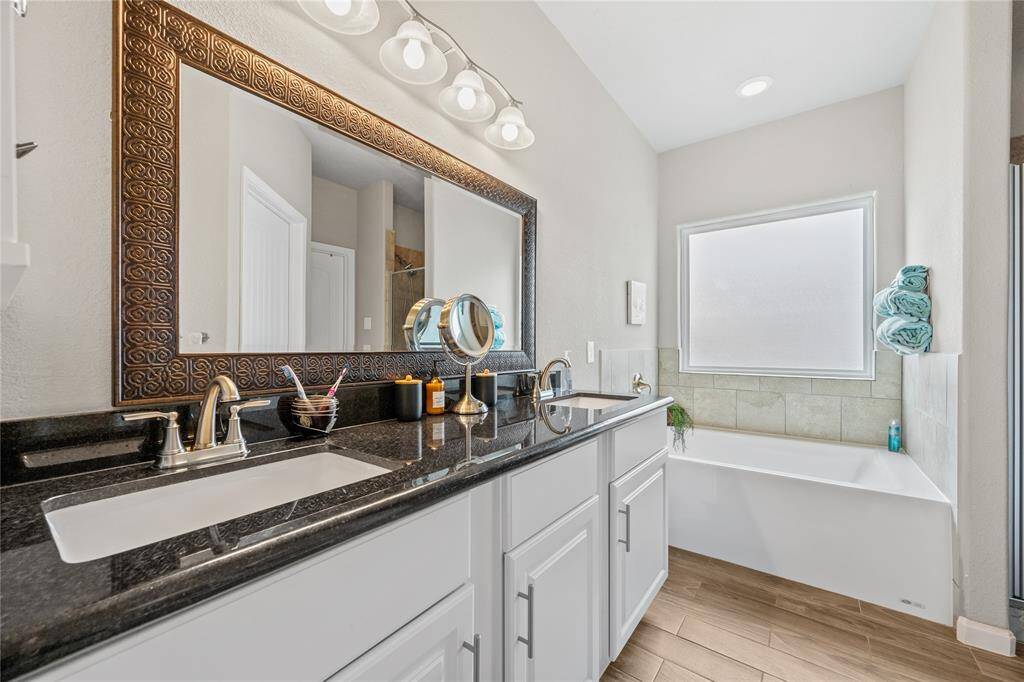 Primary bath see the double granite sinks-large soak tub-seperate shower