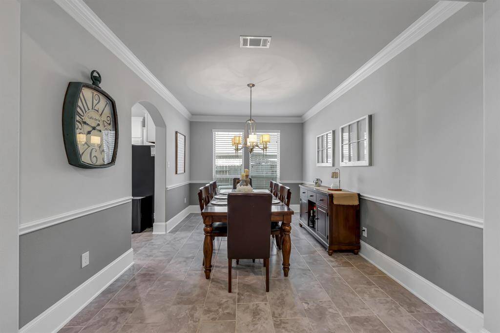 Dining area perfect for entertaining your family and guests.  Simple and sophisticated design makes this room so welcoming.