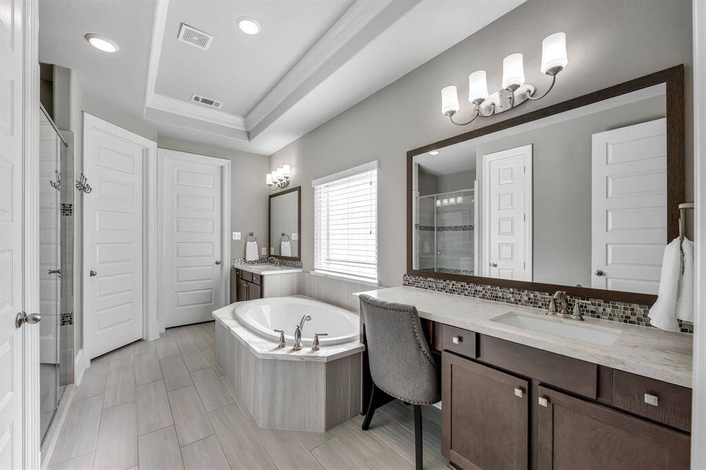 Elegant Primary bath with natural light.