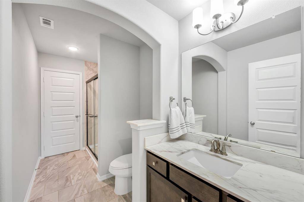 En-Suite Bath has stand up shower, beautiful countertops.