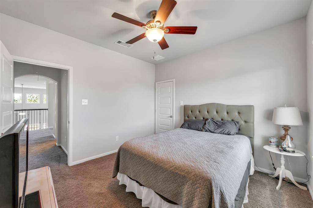 Bedroom 3 has carpet, ceiling fan and opens to finished storage.