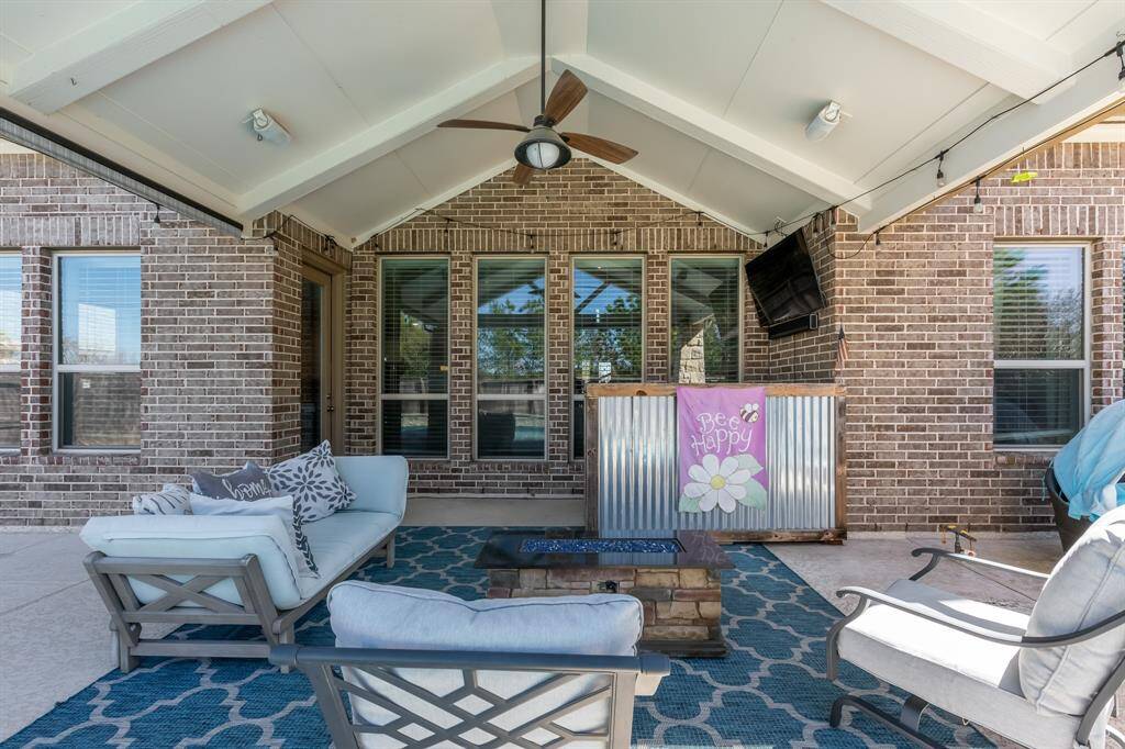 Enjoy your beautiful outside covered patio equipped with TV mount and views of your backyard oasis.