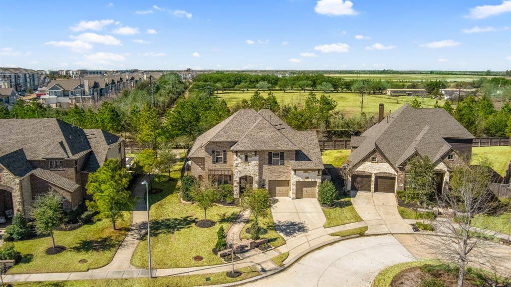 Lovely street view showcasing home on cul-de-sac street. The trail on the left provides convenient access to Josey Lake to the south and Treehouse Park to the north.