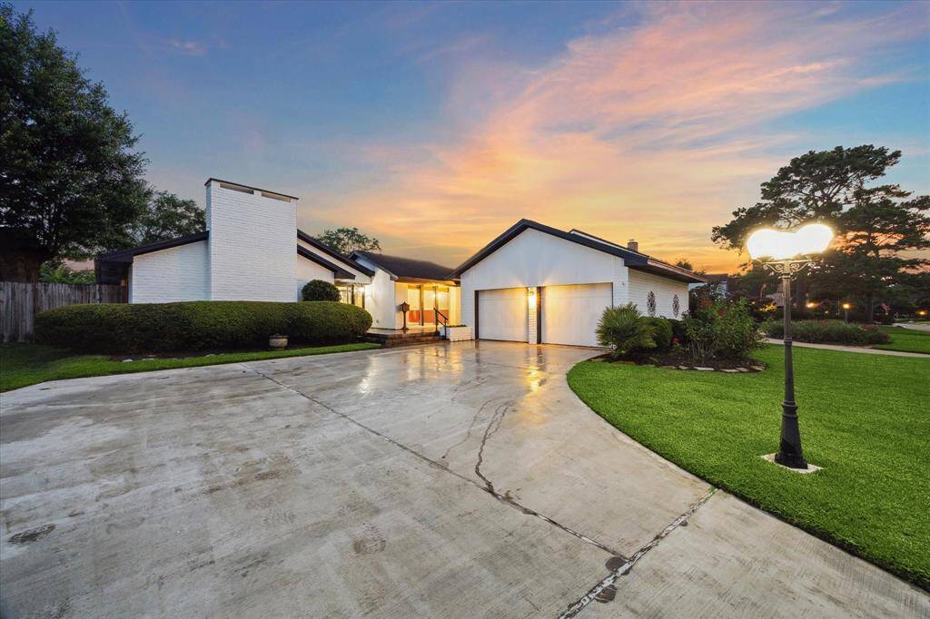 Private front patio with fabulous slate tile, perfect for enjoying your morning coffee. Check out the width of this phenomenal front door!