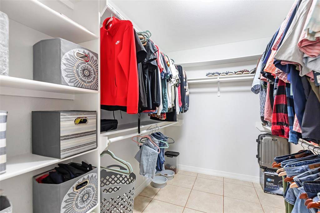 Large primary walk-in closet.