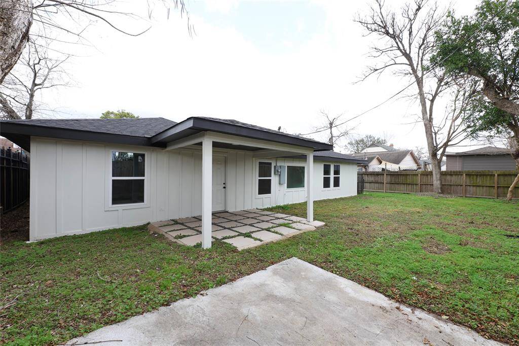 Covered patio look off to large green space. Plenty of room for pets and children to play.