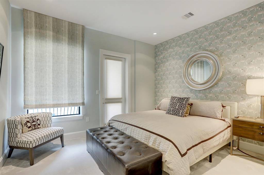 Secondary bedroom with an ensuite and access to one of the three balconies.